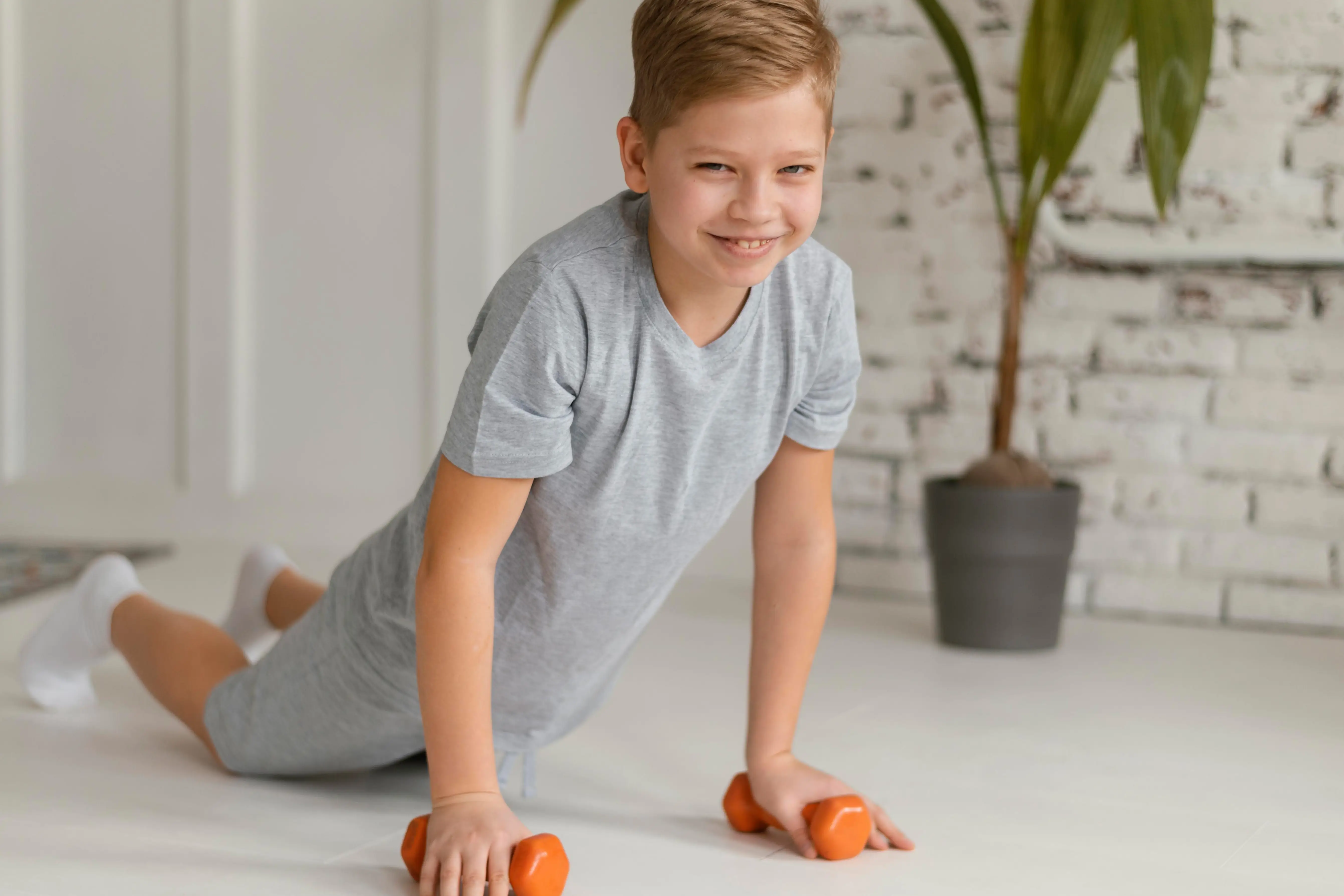 full-shot-boy-exercising-indoors